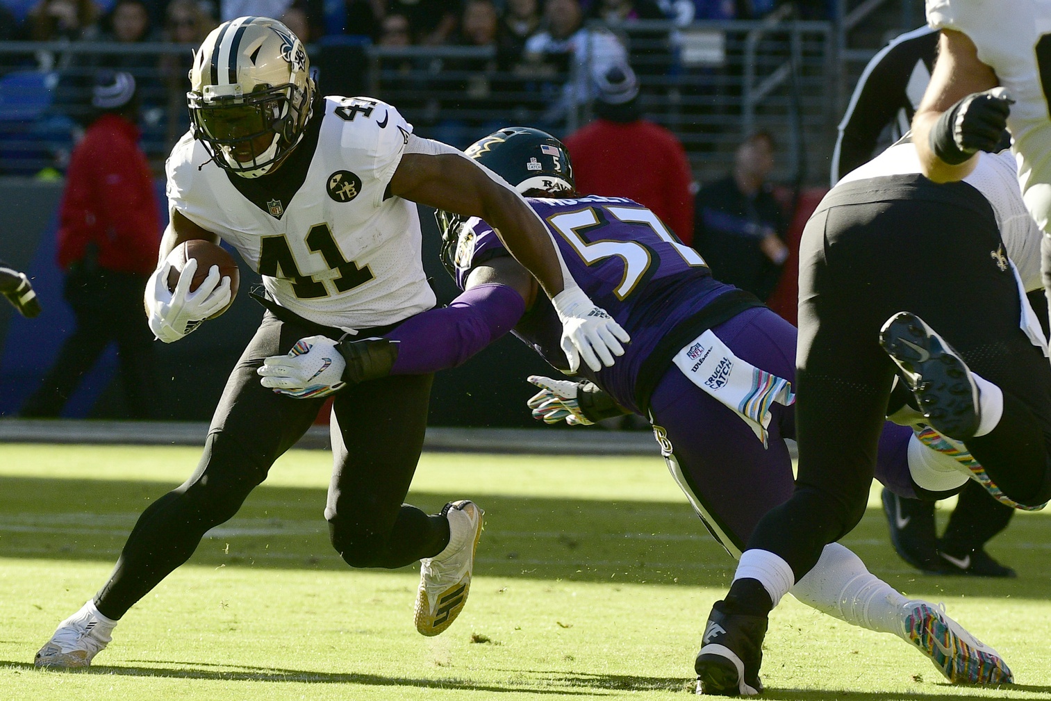 Oct 21, 2018; New Orleans Saints running back Alvin Kamara (41) runs through a Baltimore Ravens tackle attempt. Mandatory Credit: Tommy Gilligan-USA TODAY Sports